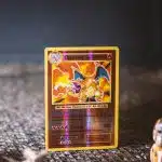 pokemon trading card on gray textile